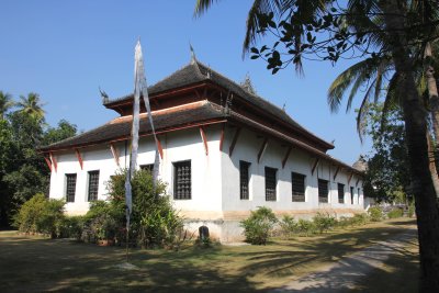 Rear view of the Wat Visoun temple with naga (snake) gargoyles.