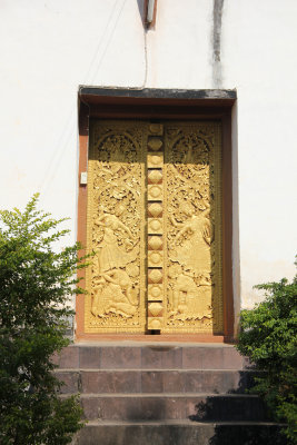 Intricate gold carvings on this rear door at the Wat Visoun temple.
