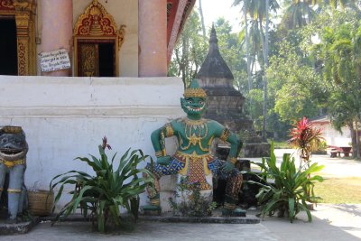 A colorful Buddhist statue outside of Wat Aham.