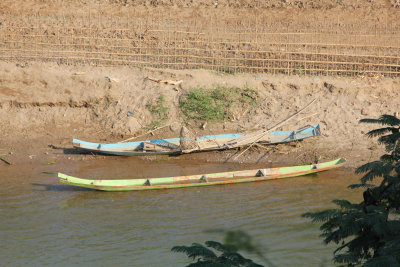 Wooden boats along the river.