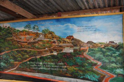 This painting depicts the pathway and some of the many stairs going up Phu Si Hill.