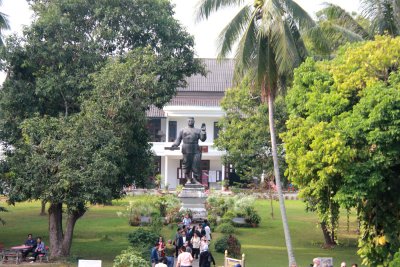 View from the the Buddhist Temple at Haw Kham (Royal Palace) complex of a statue of Savang Vatthana, the last king of Laos.