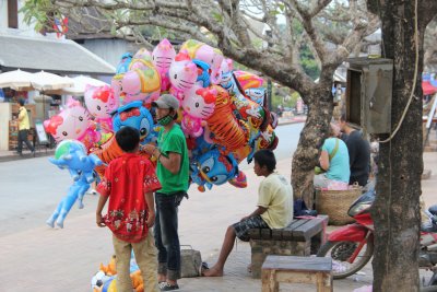 Balloon vender on a main Luang Prabang street.