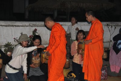 Lao girls giving alms.