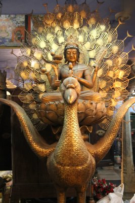 An exquisite golden peacock statue.