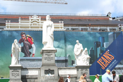 Sculptures of the Holy Ancestors in front of a jeans billboard (near St. Michaels Cathedral).