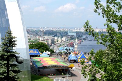 Looking at Peoples' Friendship Monument from a hill with the Dnieper River in the background.