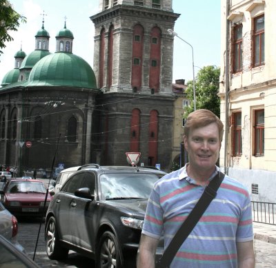 Me in front of the Kornyak Tower and the Assumption Church (about to be run over)!