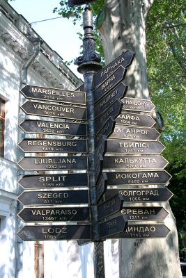 Sign in Odessa showing distances to major world cities.