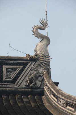A dragon on the temple's rooftop.