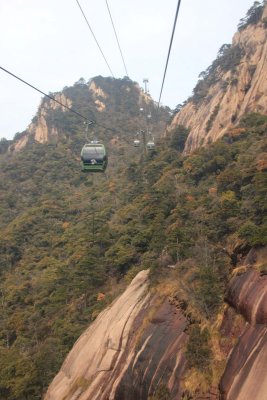 Cable cars going over some steep rocks.