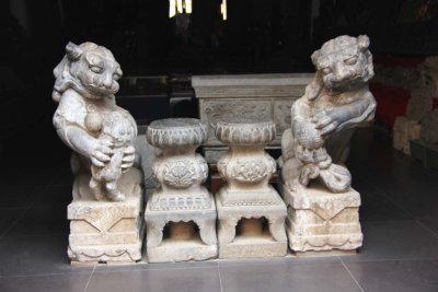 As in most Chinese statues, the female lion (on the left) holds a baby, the male lion (on the right) holds a ball.