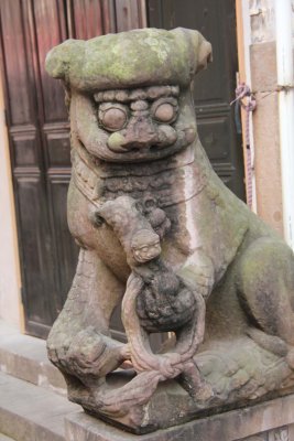 Another ancient-looking lion sculpture. Note the baby lion.