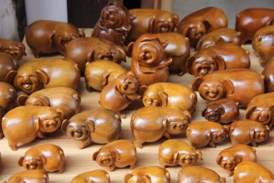 Wooden pigs for sale.