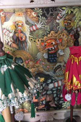 Elaborate Balinese masks and paintings at the art shop.