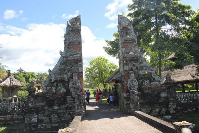 Bridge leading to the ornamental candid bentar gate, leading to the outer courtyard (jaba) of the Taman Ayun temple.