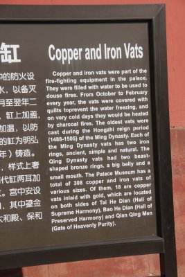 Sign describing how copper and iron vats were filled with water and used for dousing fires in the palace.