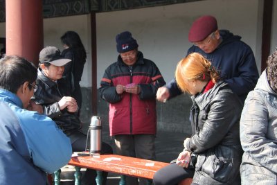 Men were playing mahjong along the long corridor that leads to the main temple grounds.