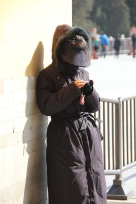 As I exited, I saw this mysterious-looking, hooded Chinese girl checking her cell phone.