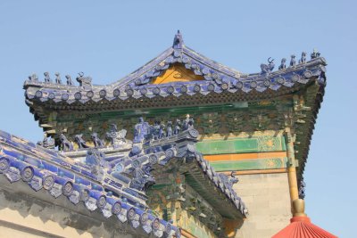 Details of the gate's roofline with blue animals. Generally, the more animals there are, the more important the structure is.