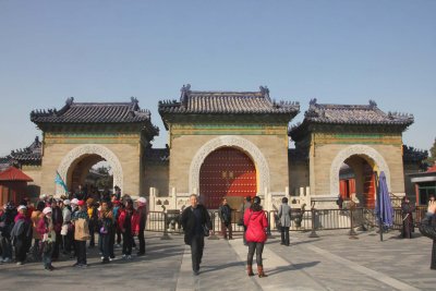 This interesting arched gate along the Imperial Way has red double doors with ornate brass knockers.