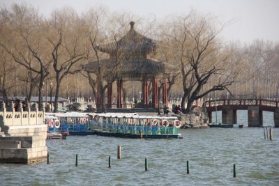 Tourist boats with the Knowing Spring Pavilion in the background.