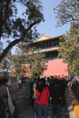 Tourists following the path to the gate.