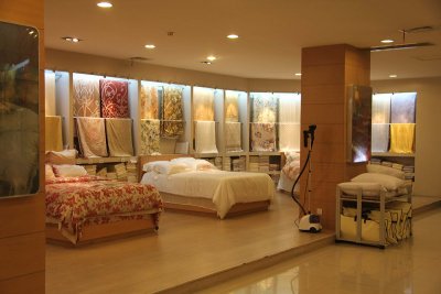 Silk bedspreads on display in the showroom.