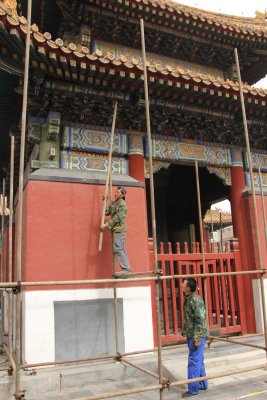Men were doing renovation work on the outside of this pavilion.