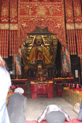 Inside the hall is a statue of Tsong Khapa, the father of the Yellow Hat Sect of Tibetan Buddhism.