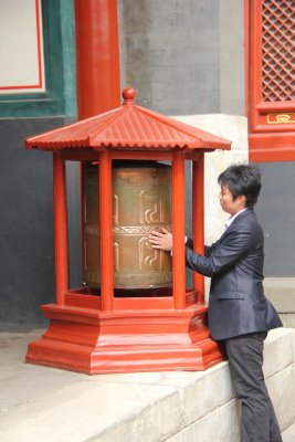 This man was spinning the prayer wheel outside of Hall of the Dharma Wheel. It can be likened to Buddha's Dharma Wheel.