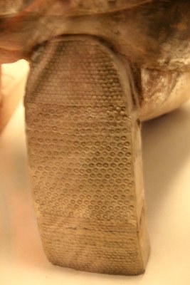 Close-up of the tread on the square-toed shoes.