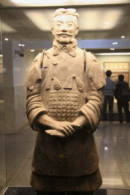 Display behind plexiglass at Pit No. 2 of a high-ranking officer. He is one of seven generals found in the terracotta pits.