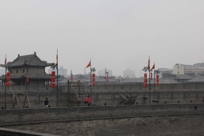 City wall view with defensive weapons and tower.