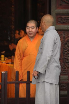 Two monks conferring with each other.