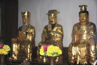 These golden Buddha statues inside the building.