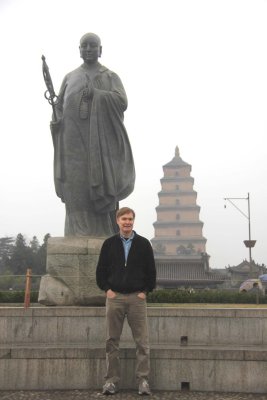Me standing in front of the statue of Xuanzang and the Wild Goose Pagoda in Xi'an.