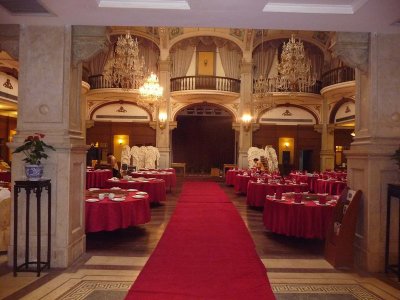 Red carpet leading into the elegant dining room.