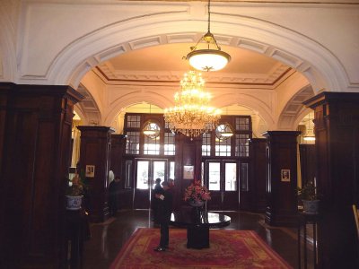 View of the hotel's baroque-style entrance hall with its rich dark wooden paneling.