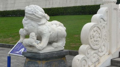Female lion sculpture at the base of the stairs.  Note the baby lion.