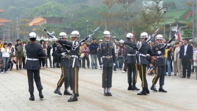 The soldiers were lifting their bayonets high as they performed their ceremony.