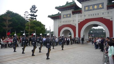 Note the arched entrance gate of the Martyrs' Shrine with the changing of the guard ceremony wrapping up.