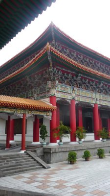 Elaborate decoration at a corner of the building and of the cornice.