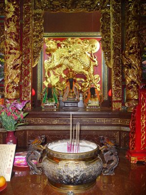 Another shrine in the Lungshan Temple with an incense burner in front.