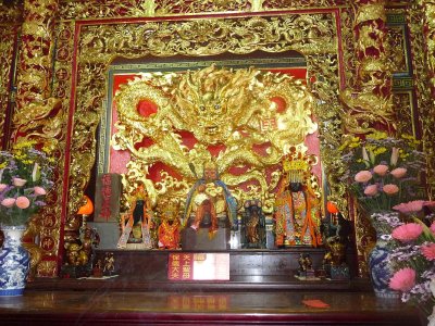 Shrine inside Lungshan Temple with a magnificent golden dragon.