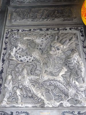 A chivalric portrayal of a swordsman fighting a dragon.