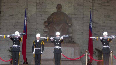 Rifles lifted during the changing of the guard ceremony.