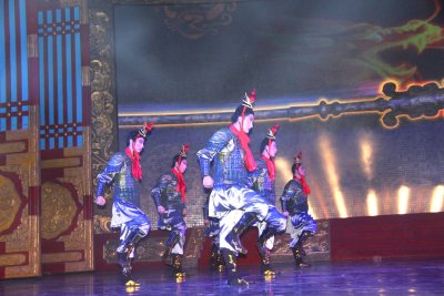 Chinese men dancing in period costumes.