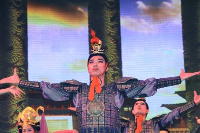 A Tang warrior taking his bows with the rest of the dancers.