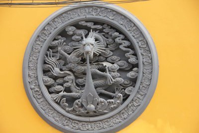 Close-up of dragon medallion.